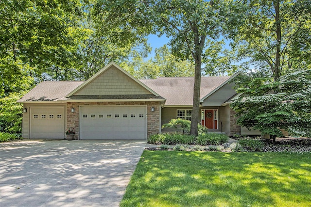 3314 Westview Ct, Allegan, MI 49010 - view of front of home with a garage, driveway, a front yard, and roof with shingles
