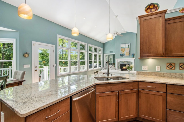 3314 Westview Ct, Allegan, MI 49010 - kitchen with stainless steel dishwasher, brown cabinetry, lofted ceiling, and ceiling fan
