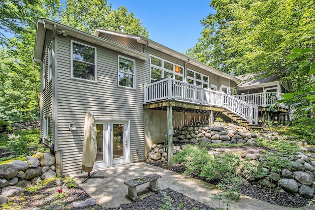 3314 Westview Ct, Allegan, MI 49010 - back of property with a wooden deck and stairway