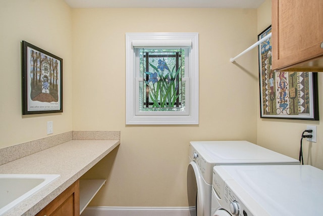 3314 Westview Ct, Allegan, MI 49010 - laundry area featuring washer and dryer and cabinet space