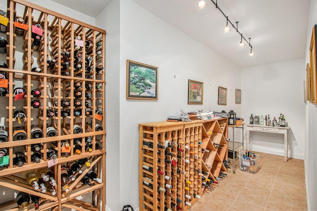 3314 Westview Ct, Allegan, MI 49010 - wine room featuring tile patterned flooring and track lighting