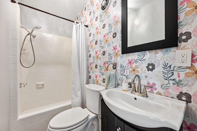 1908 Niles Ave, Saint Joseph, MI 49085 - bathroom with tiled shower / bath combo, vanity, and wallpapered walls