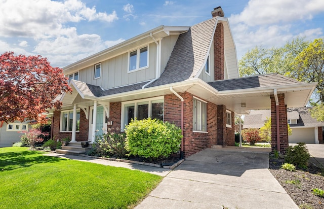 1908 Niles Ave, Saint Joseph, MI 49085 - view of front facade with board and batten siding, a chimney, a front yard, roof with shingles, and brick siding