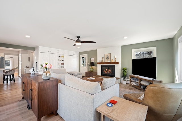 1908 Niles Ave, Saint Joseph, MI 49085 - living area with a brick fireplace, ceiling fan, recessed lighting, and light wood finished floors
