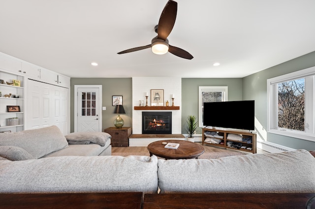 1908 Niles Ave, Saint Joseph, MI 49085 - living room with healthy amount of natural light, ceiling fan, wood finished floors, recessed lighting, and a glass covered fireplace