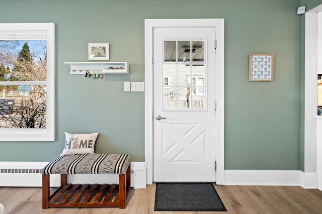 1908 Niles Ave, Saint Joseph, MI 49085 - doorway to outside with baseboard heating and wood finished floors