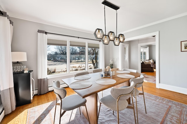 1908 Niles Ave, Saint Joseph, MI 49085 - dining room featuring ornamental molding, light wood-style floors, a baseboard heating unit, and a chandelier