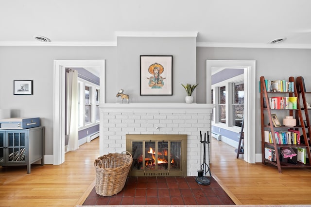 1908 Niles Ave, Saint Joseph, MI 49085 - living area with crown molding, wood finished floors, and a fireplace