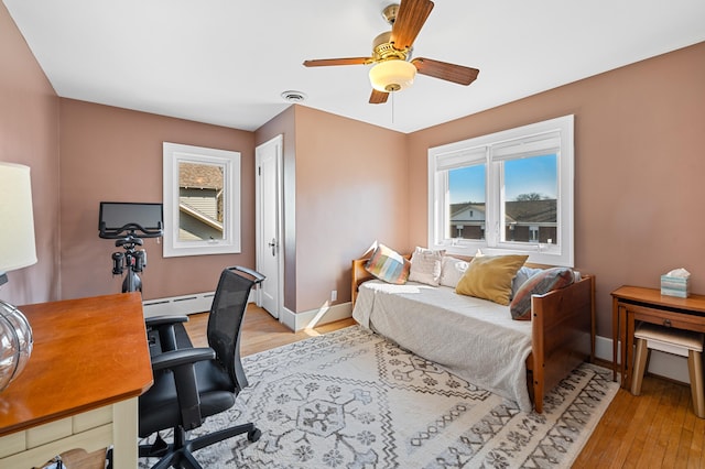 1908 Niles Ave, Saint Joseph, MI 49085 - home office featuring baseboard heating, light wood-type flooring, and ceiling fan
