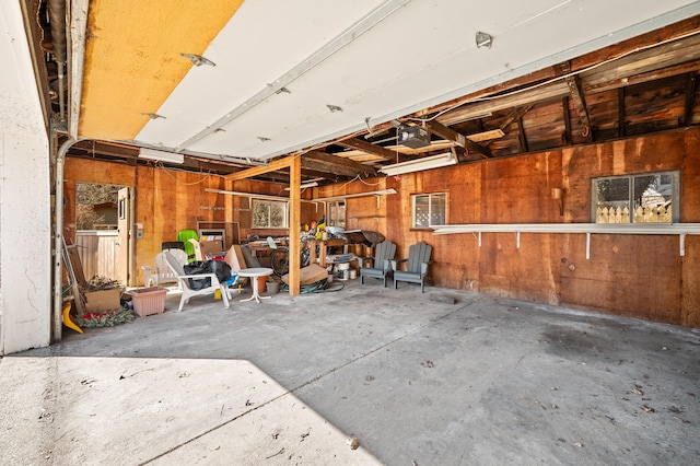 1908 Niles Ave, Saint Joseph, MI 49085 - garage featuring wood walls and a garage door opener