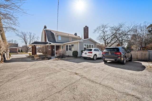 1908 Niles Ave, Saint Joseph, MI 49085 - back of house featuring a chimney and a shingled roof