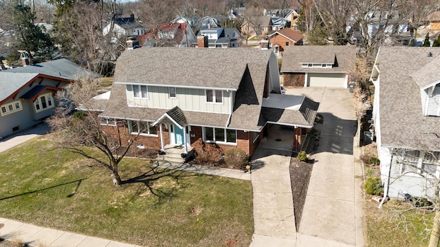 1908 Niles Ave, Saint Joseph, MI 49085 - view of front of house with brick siding, roof with shingles, a residential view, and a front yard