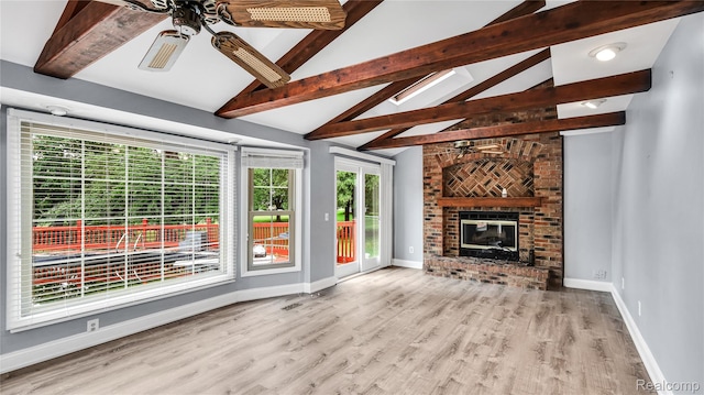 6596 Corral Ct, West Bloomfield, MI 48324 - unfurnished living room with a ceiling fan, a fireplace, and wood finished floors