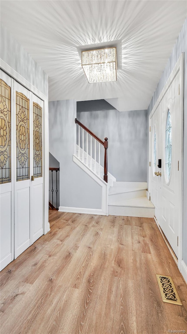 6596 Corral Ct, West Bloomfield, MI 48324 - entryway featuring stairway and wood finished floors