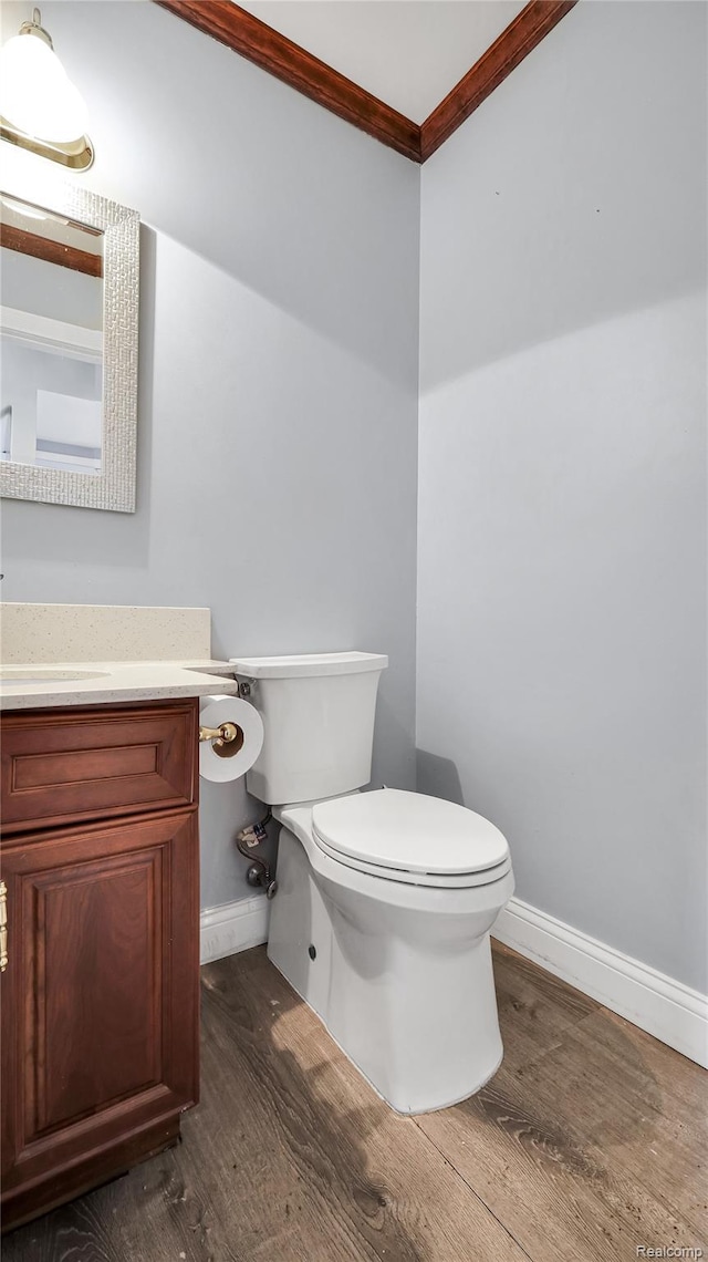 6596 Corral Ct, West Bloomfield, MI 48324 - half bath featuring wood finished floors, ornamental molding, and vanity