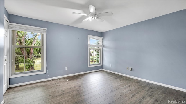 6596 Corral Ct, West Bloomfield, MI 48324 - spare room with a ceiling fan and wood finished floors