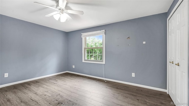 6596 Corral Ct, West Bloomfield, MI 48324 - empty room featuring wood finished floors and a ceiling fan