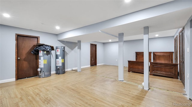 6596 Corral Ct, West Bloomfield, MI 48324 - finished basement featuring water heater, recessed lighting, and light wood finished floors