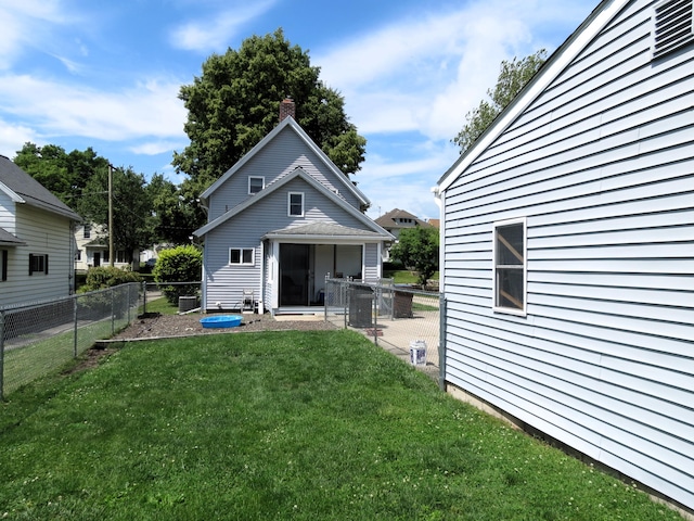 1513 Joy Ave, Jackson, MI 49203 - back of property with a chimney