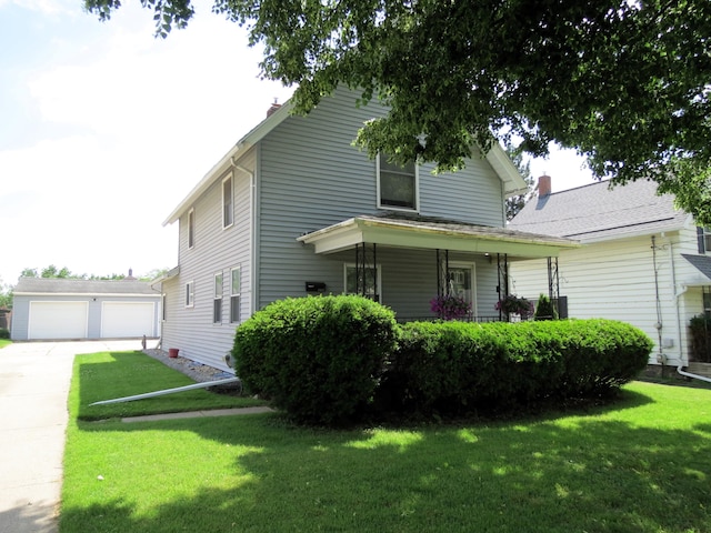 1513 Joy Ave, Jackson, MI 49203 - view of front of property featuring a front yard, a garage, a chimney, and covered porch