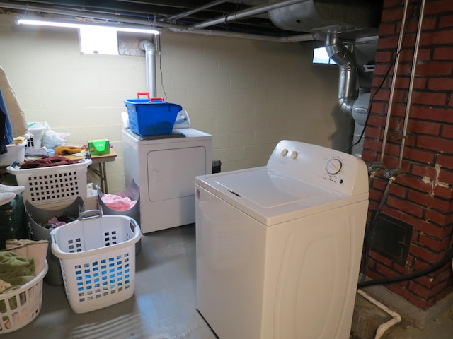 1513 Joy Ave, Jackson, MI 49203 - laundry room with washer and dryer and concrete block wall