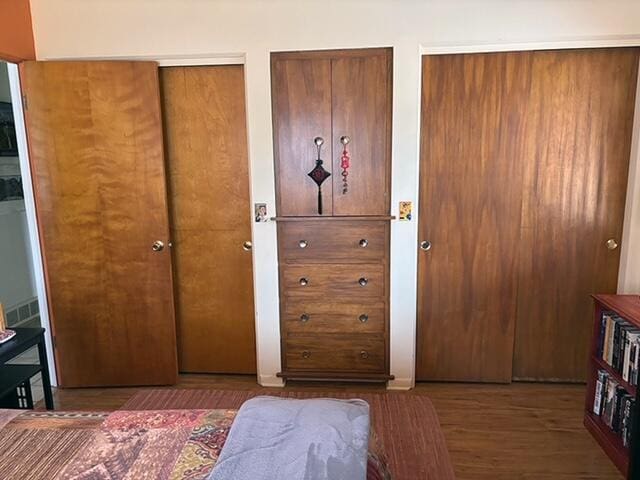 2975 Princeton Ct, Muskegon, MI 49441 - bedroom featuring multiple closets and wood finished floors