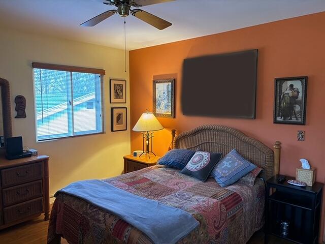 2975 Princeton Ct, Muskegon, MI 49441 - bedroom featuring wood finished floors and a ceiling fan
