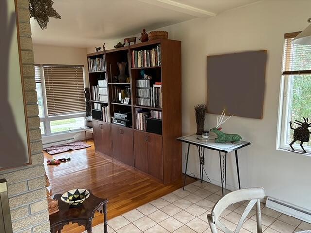 2975 Princeton Ct, Muskegon, MI 49441 - living area featuring baseboard heating and light tile patterned floors