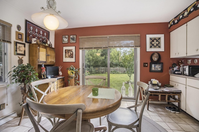 2975 Princeton Ct, Muskegon, MI 49441 - dining room with a baseboard heating unit and light tile patterned flooring