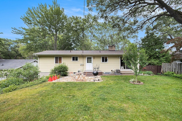 2975 Princeton Ct, Muskegon, MI 49441 - rear view of house featuring a patio and a chimney