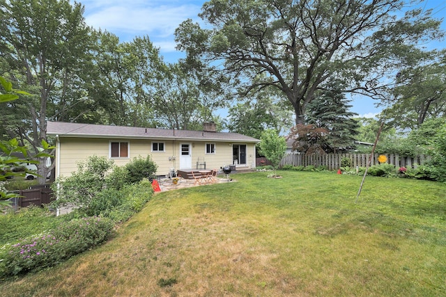 2975 Princeton Ct, Muskegon, MI 49441 - rear view of property featuring a chimney and a patio area