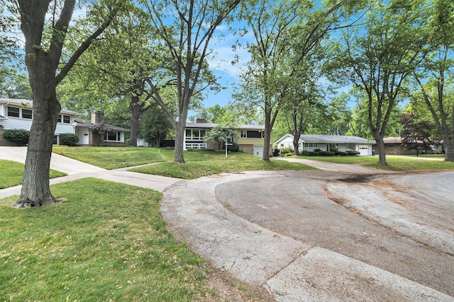 2975 Princeton Ct, Muskegon, MI 49441 - view of front facade with driveway and a front lawn
