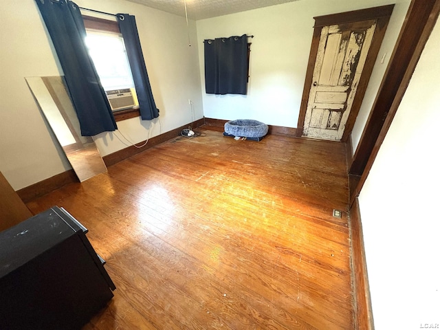 7408 Carleton Rd, Clayton, MI 49235 - spare room with wood finished floors and cooling unit