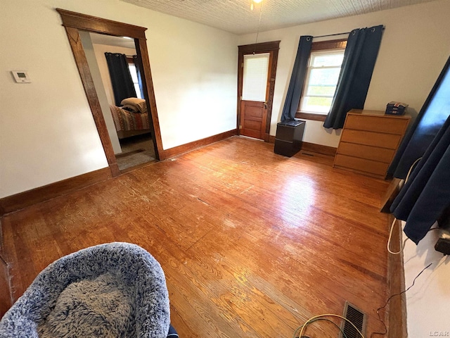 7408 Carleton Rd, Clayton, MI 49235 - unfurnished room with light wood-style floors and baseboards