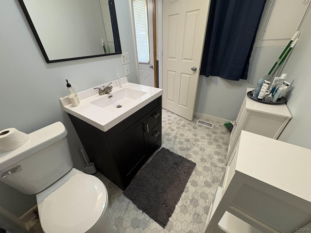 7408 Carleton Rd, Clayton, MI 49235 - bathroom featuring vanity and toilet
