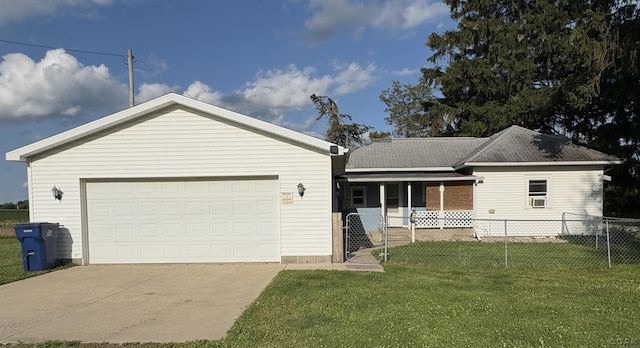 7408 Carleton Rd, Clayton, MI 49235 - ranch-style home with covered porch, a garage, concrete driveway, and a gate