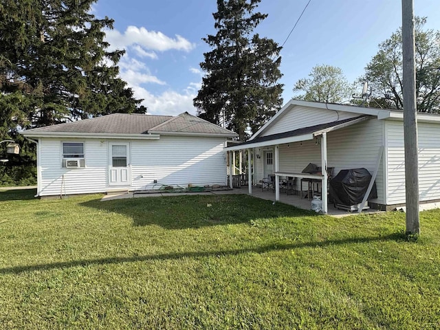 7408 Carleton Rd, Clayton, MI 49235 - rear view of property featuring a yard, a patio area, and cooling unit