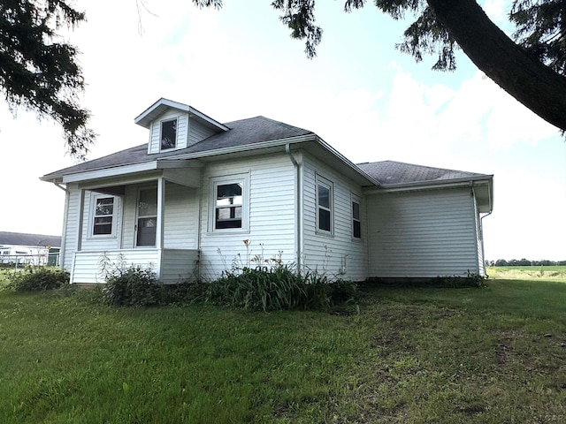 7408 Carleton Rd, Clayton, MI 49235 - view of side of property featuring a lawn