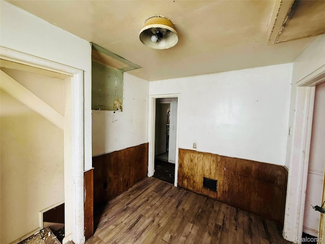 18241 Kentfield St, Detroit, MI 48219 - empty room featuring a wainscoted wall, wood finished floors, and wood walls