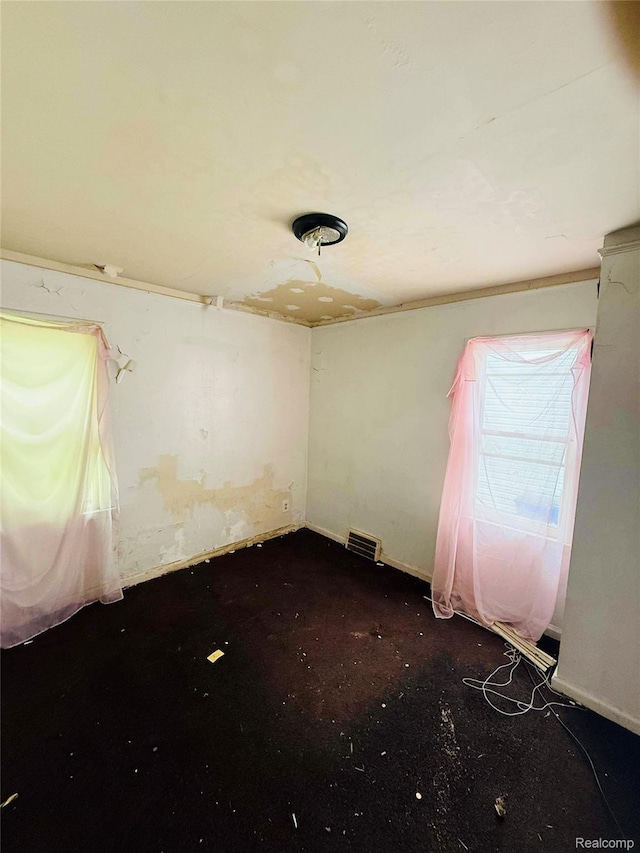 18241 Kentfield St, Detroit, MI 48219 - spare room with baseboards and dark colored carpet