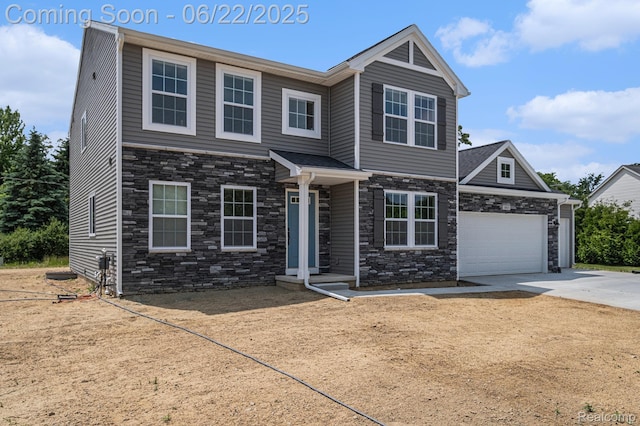 1013 Lancaster St, Lapeer, MI 48446 - view of front of home with stone siding, driveway, and a garage
