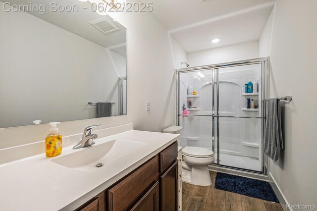 1013 Lancaster St, Lapeer, MI 48446 - bathroom featuring vanity, a shower stall, and wood finished floors