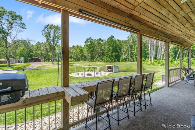 2539 Daisy Ln, Middleville, MI 49333 - view of patio featuring outdoor dining area and view of scattered trees
