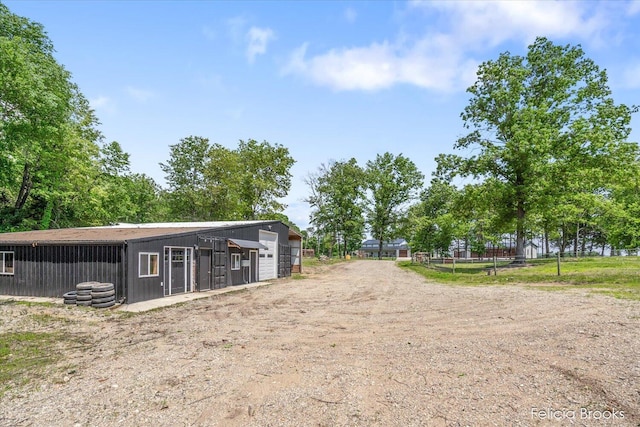 2539 Daisy Ln, Middleville, MI 49333 - view of yard featuring a garage and an outbuilding