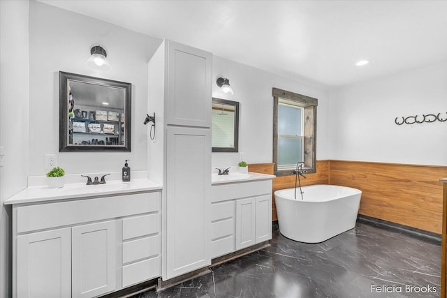 2539 Daisy Ln, Middleville, MI 49333 - bathroom with double vanity, a soaking tub, and marble finish floors