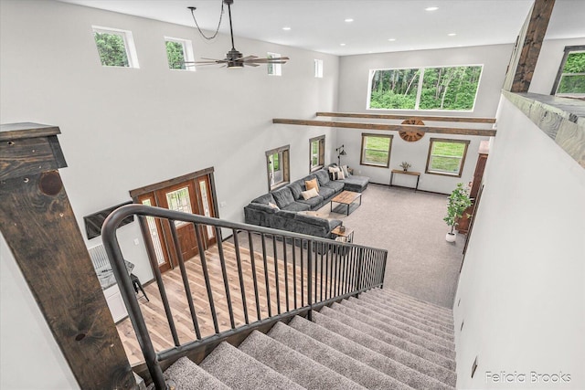 2539 Daisy Ln, Middleville, MI 49333 - stairs featuring a high ceiling, a ceiling fan, carpet floors, and recessed lighting