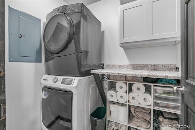 2539 Daisy Ln, Middleville, MI 49333 - laundry room with stacked washing machine and dryer, electric panel, and cabinet space