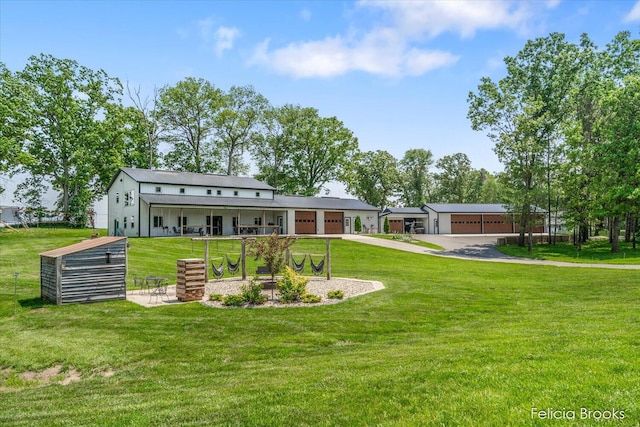 2539 Daisy Ln, Middleville, MI 49333 - back of house featuring a yard and driveway