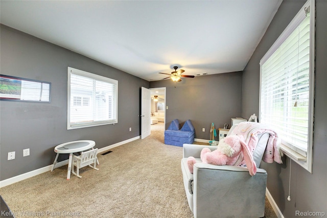1320 W Drahner Rd, Oxford, MI 48371 - living area with ceiling fan and carpet flooring