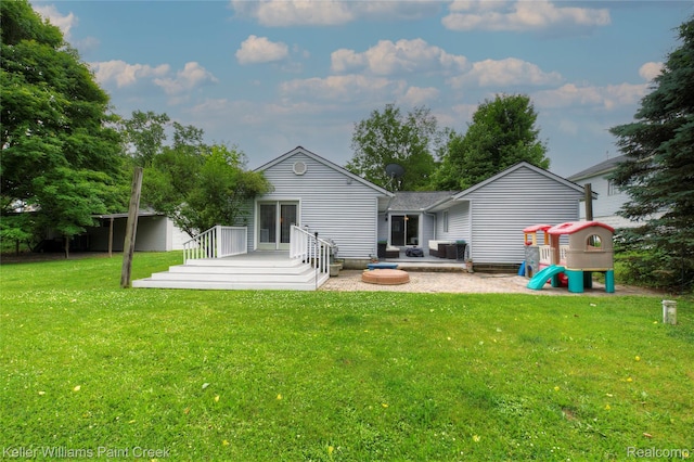 1320 W Drahner Rd, Oxford, MI 48371 - back of house featuring a yard and a patio area